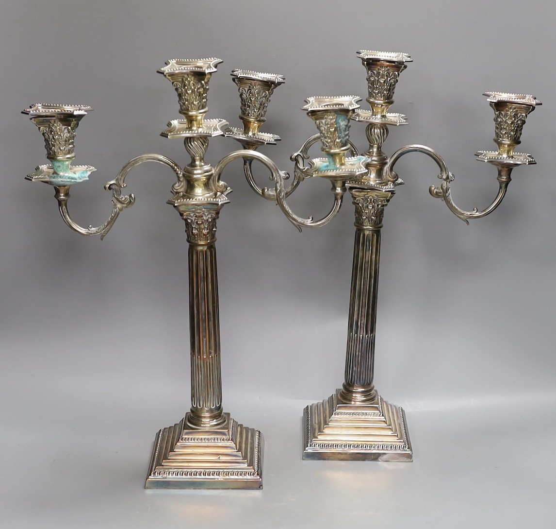 Pair of EPNS corinthian column candelabra, 44cms